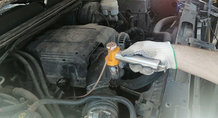 How does an oil change at a dealer differ from garage work?