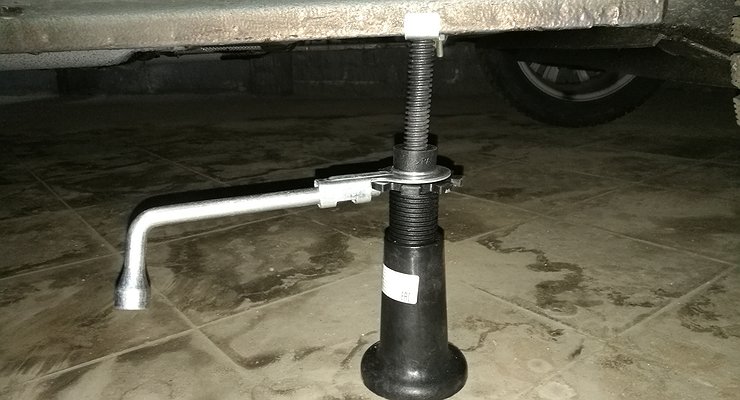 Why should you immediately throw away the standard jack after buying a car?