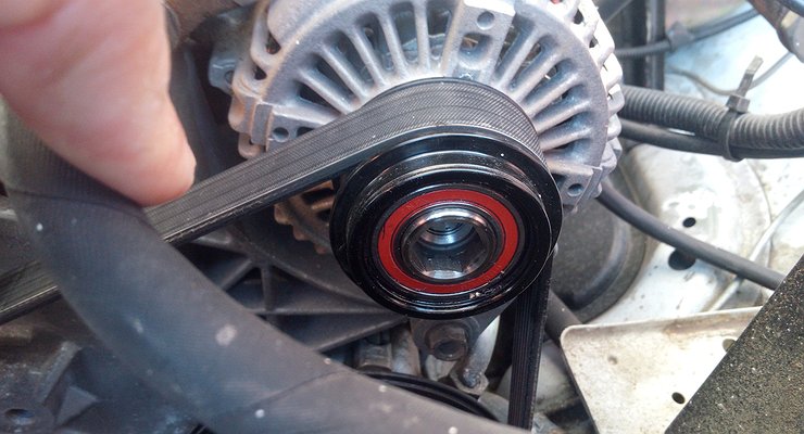 Why is it important to check the alternator pulley before the cold weather