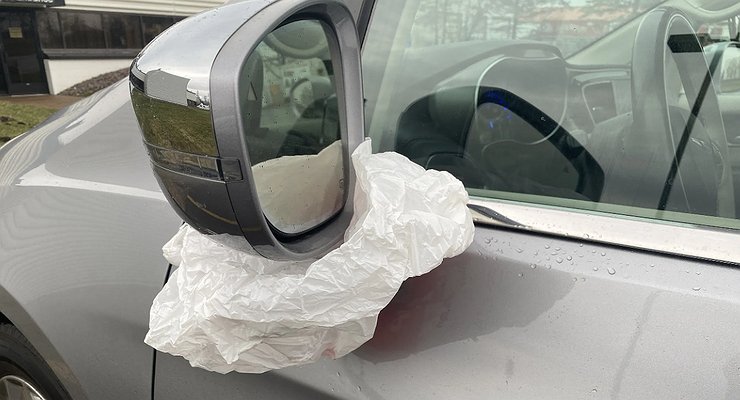 Why do some drivers hang a bag on their rear view mirror?