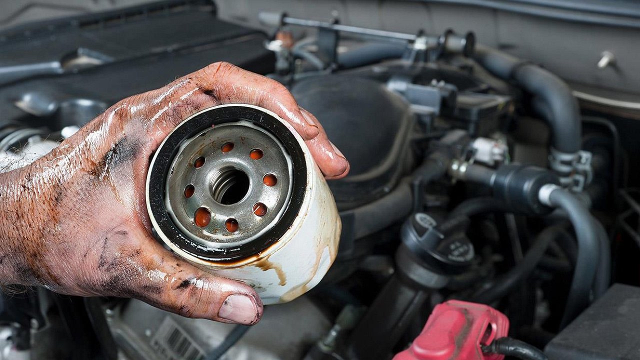 Why do you need to shine ultraviolet light on the oil filter before replacing it?