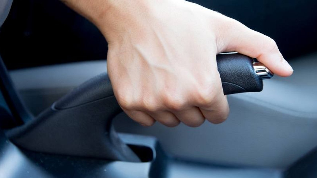 What should you be afraid of if the handbrake icon suddenly lights up on the dashboard