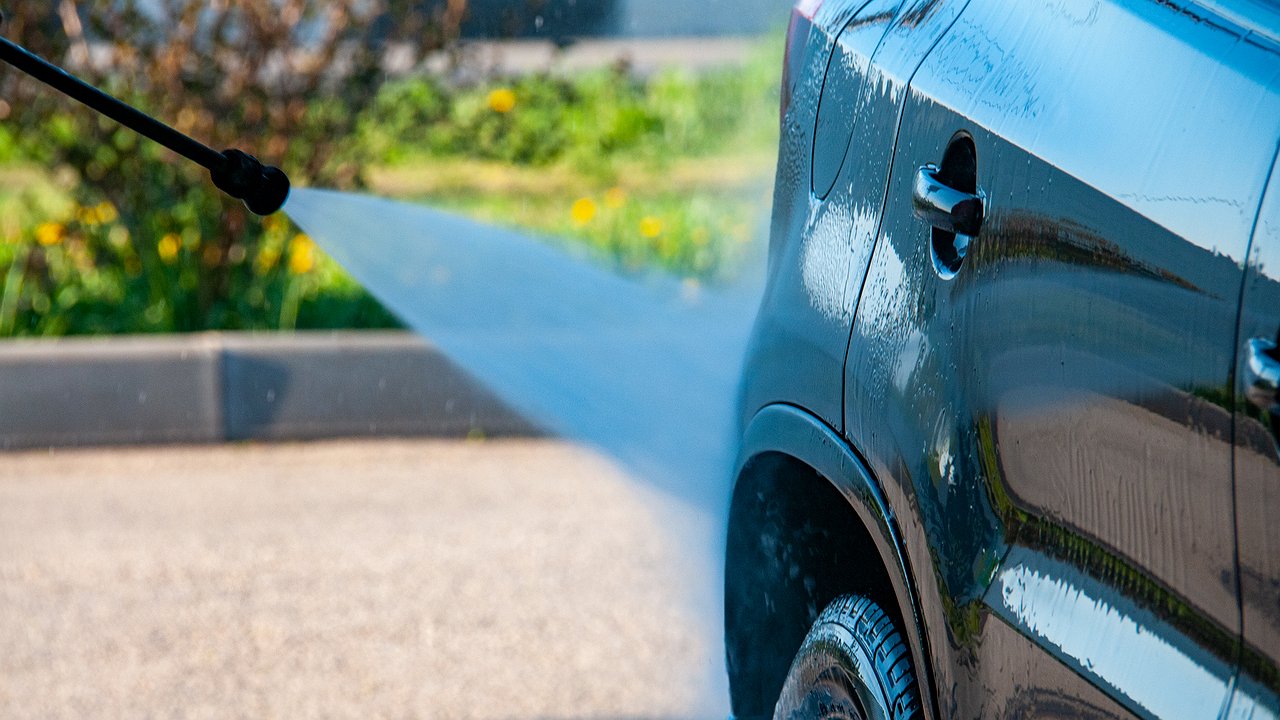 Why do experienced drivers carry a thin brush to the car wash?