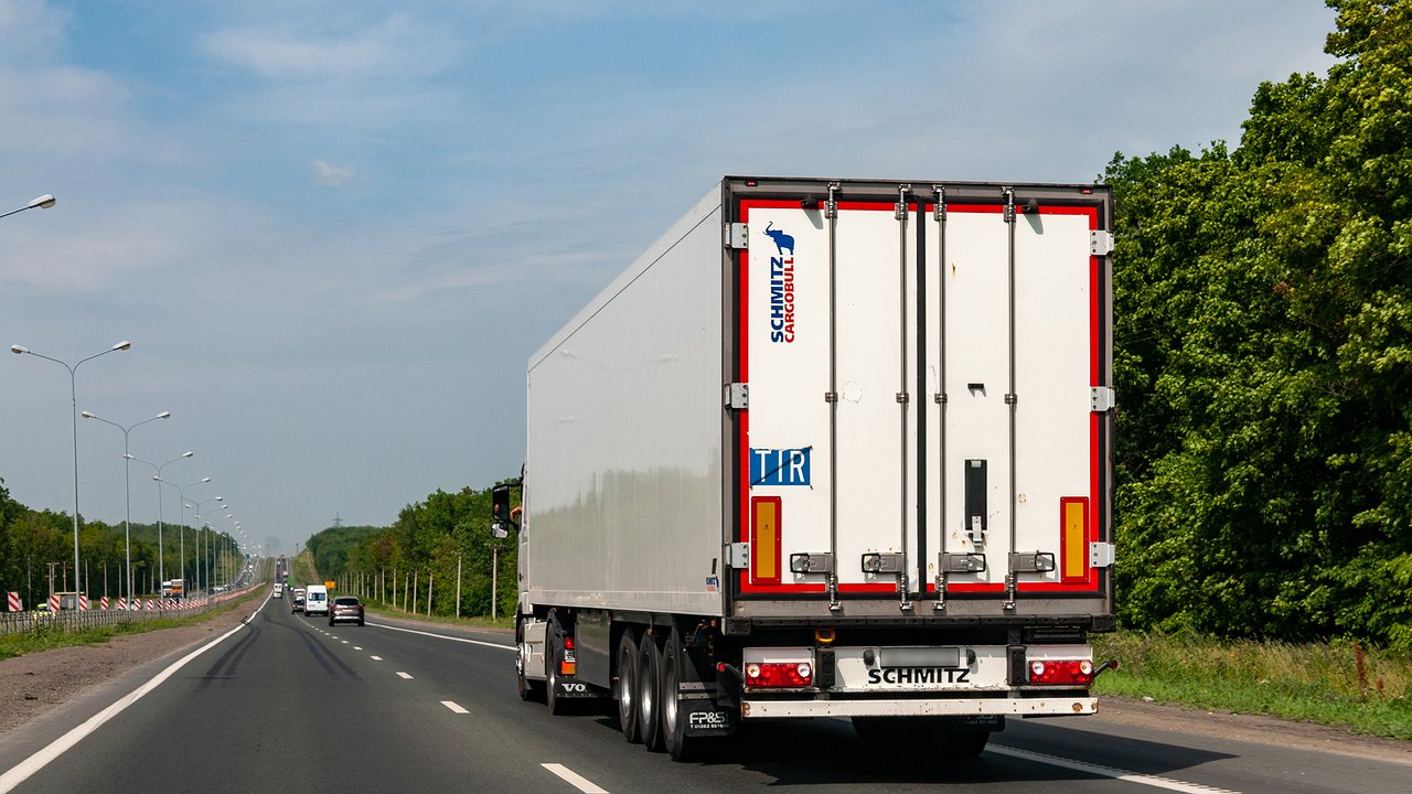 Why do truck drivers hang a reflective vest on their side mirror?